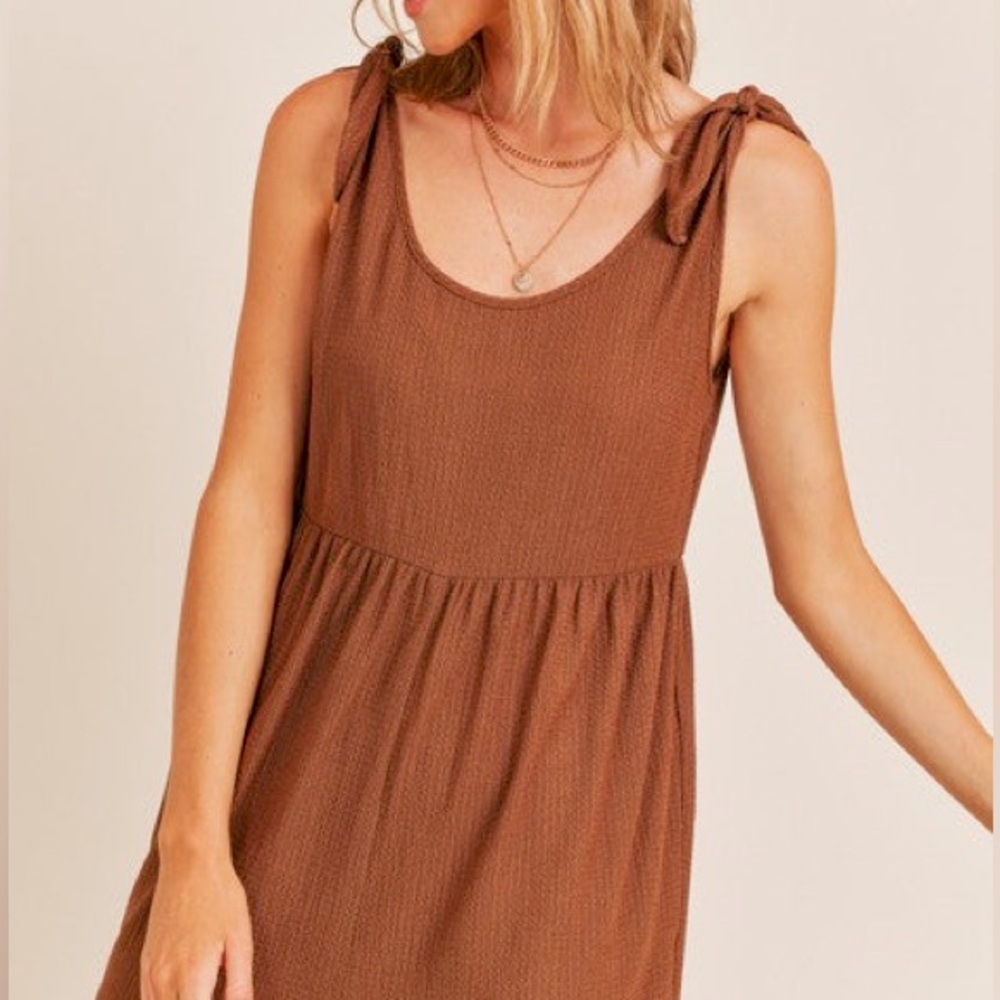Brand new, only worn once! Size medium, brown textured romper!